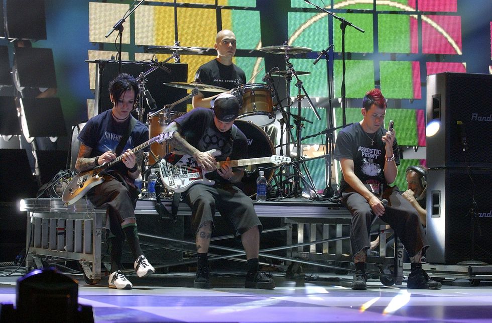 Guitarists Billy, Benji Madden, drummer Chris and singer Joel Madden of the band Good Charlotte take a break during their rehearsal for the 2003 MTV Video Music Awards at Radio City Music Hall August 26, 2003 in New York City. The show airs live on Thursday, August 28 at 8:00PM EST. (Photo by Frank Micelotta/Getty Images)