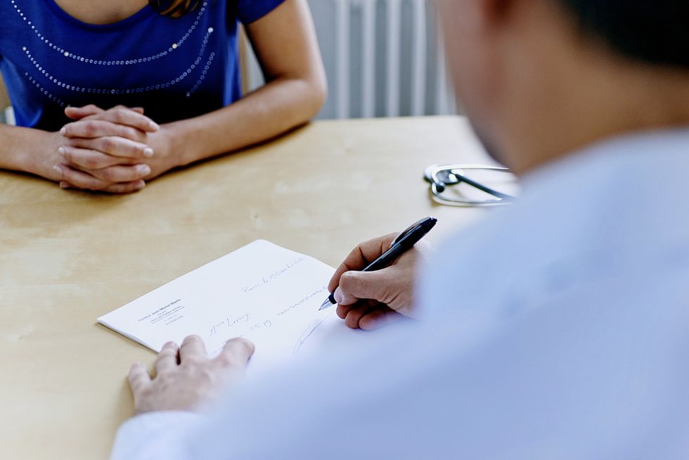 Female patient in a GP surgery