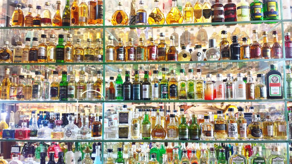 Full Frame Shot Of Alcohol Bottles In Shelf | ELLE UK
