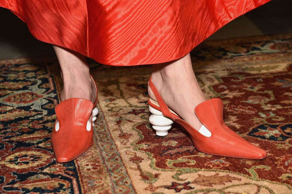 Red, Footwear, Leg, Human leg, Orange, Shoe, High heels, Ankle, Close-up, Joint, 