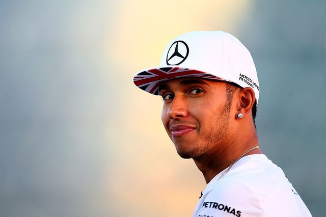 Lewis Hamilton of Great Britain and Mercedes GP looks on as he speaks with members of the media during previews ahead of the Abu Dhabi Formula One Grand Prix at Yas Marina Circuit on November 20, 2014 in Abu Dhabi, United Arab Emirates | ELLE UK