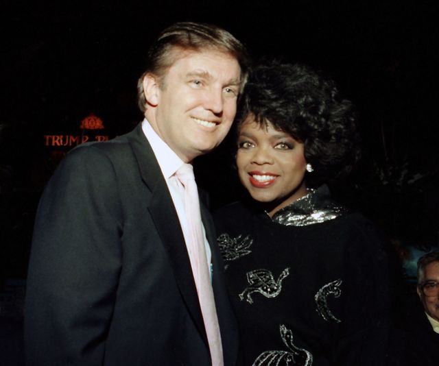 Businessman Donald Trump and Oprah Winfrey at Tyson vs Holmes Convention Hall in Atlantic City, New Jersey January 22 1988 | ELLE UK