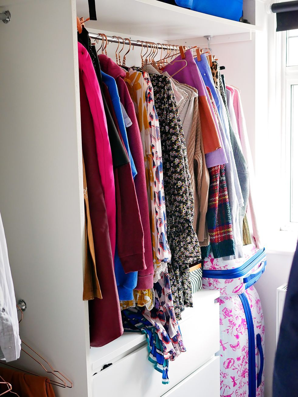 Textile, Room, Clothes hanger, Electric blue, Door, Retail, Closet, Home accessories, Fashion design, Collection, 