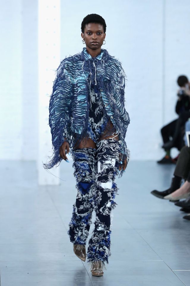 Blue, Fashion show, Human body, Shoulder, Joint, Runway, Style, Fashion model, Camouflage, Military camouflage, 