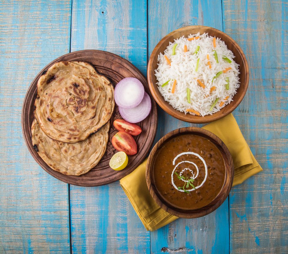 Dal Makhani or daal makhni or Daal makhani, indian lunch/dinner item served with plain rice and butter Roti, Chapati, Paratha and salad | ELLE UK