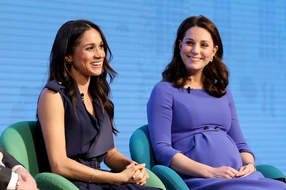 meghan markle and kate middleton sitting side by side at event