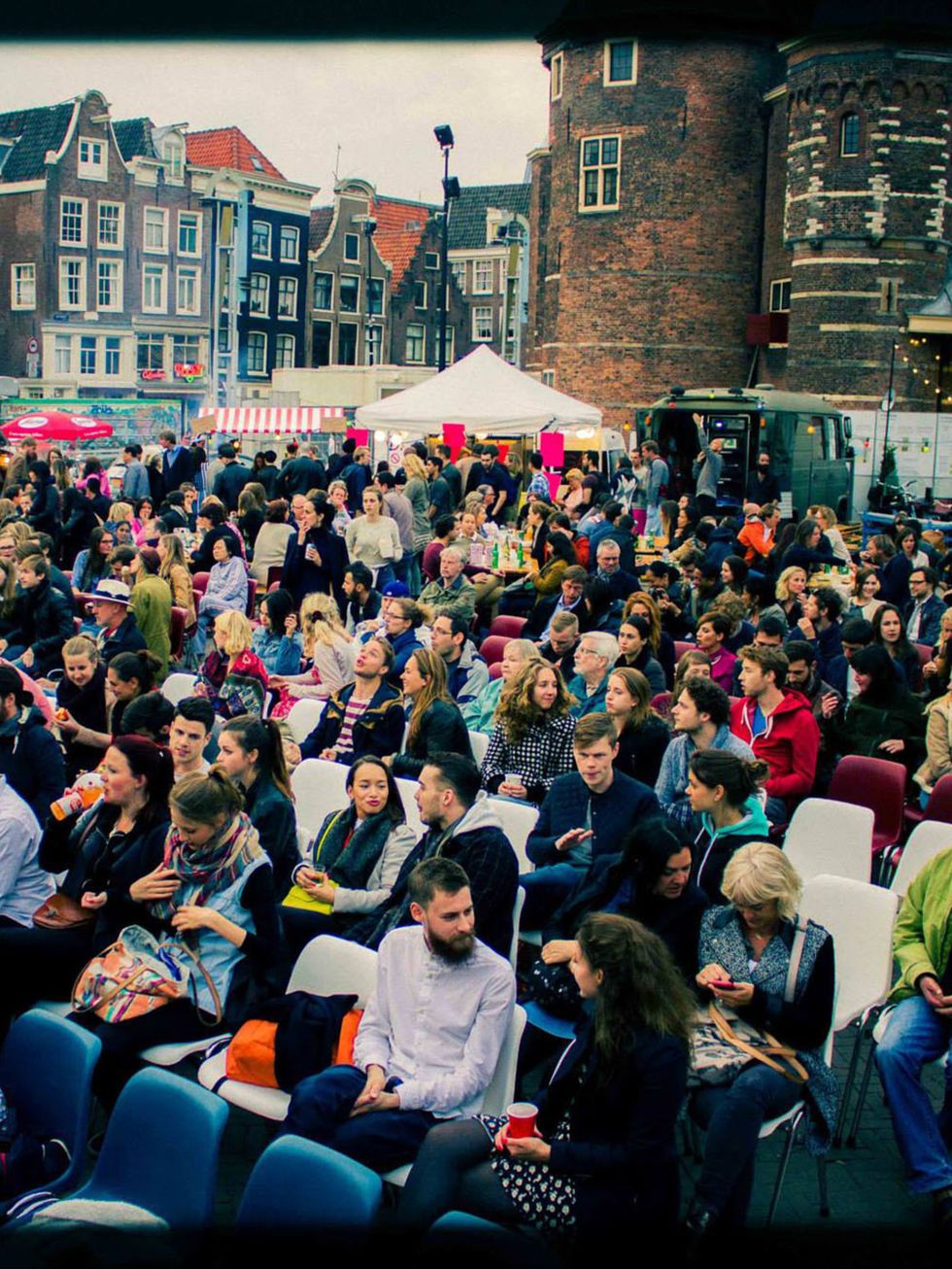 People, Crowd, Audience, Public space, Sitting, Convention, Block party, Umbrella, Town square, 