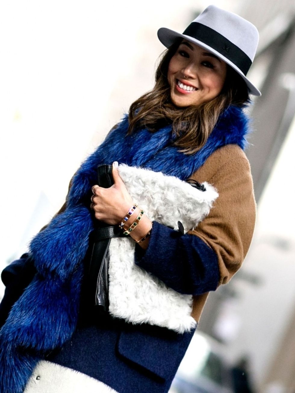 Human, Hat, Textile, Outerwear, Fashion accessory, Style, Natural material, Winter, Costume accessory, Electric blue, 