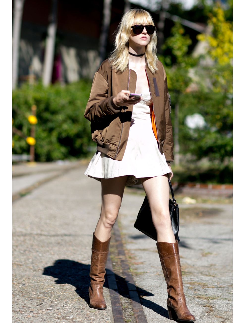 Clothing, Brown, Human leg, Sunglasses, Textile, Joint, Outerwear, Boot, Style, Street fashion, 