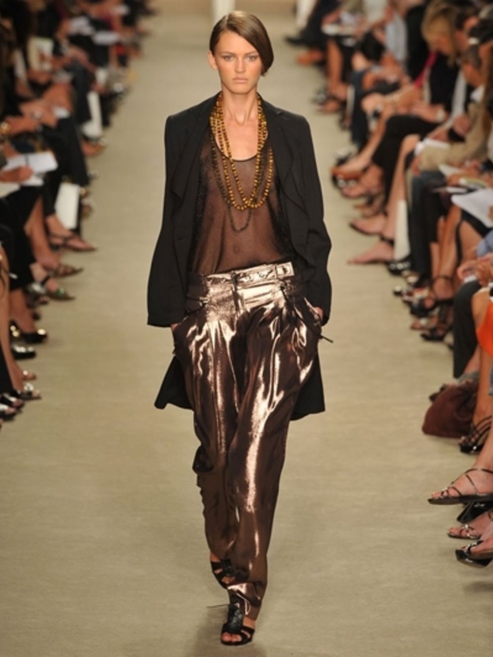 Clothing, Footwear, Brown, Fashion show, Shoulder, Joint, Runway, Outerwear, Jewellery, Style, 