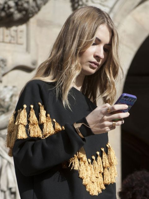 Textile, Mobile phone, Street fashion, Long hair, Blond, Glove, Portable communications device, Communication Device, Brown hair, Telephony, 