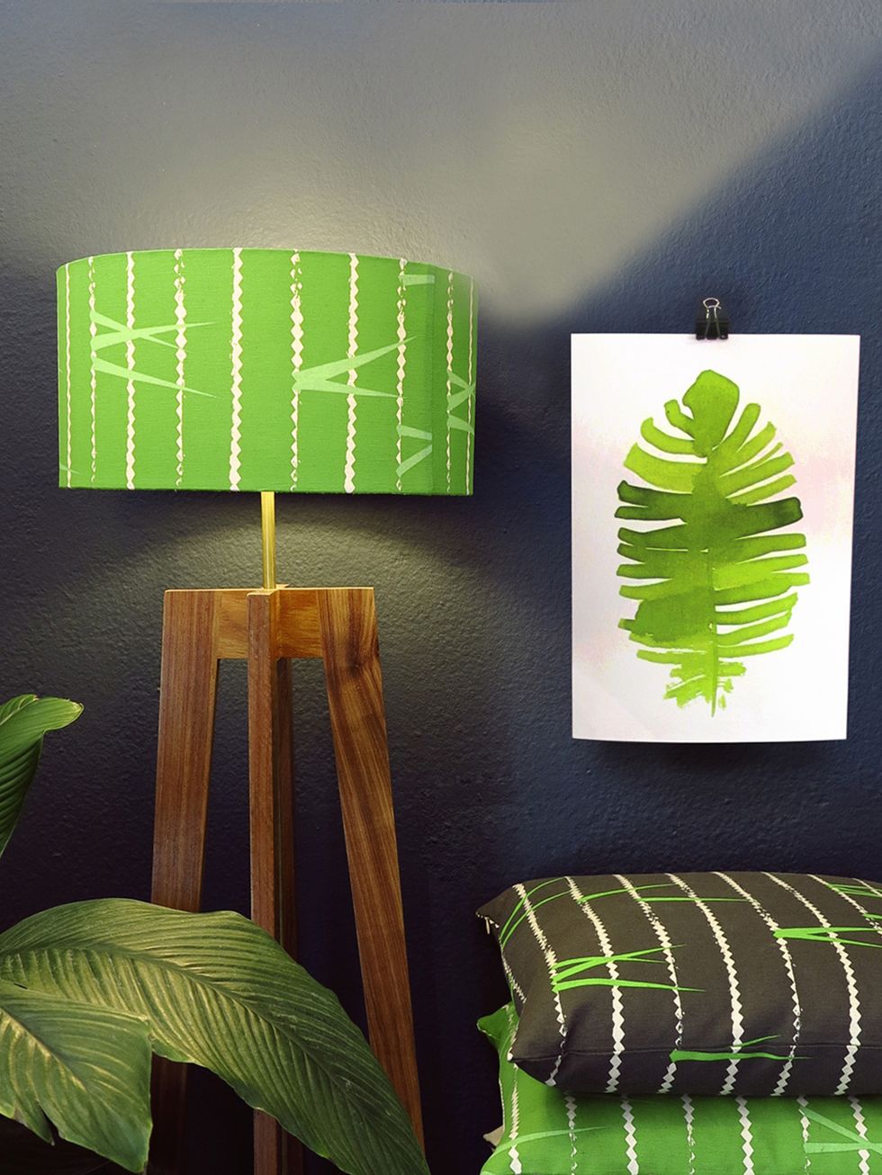 Green, Wood, Leaf, Lighting accessory, Terrestrial plant, Paint, Lampshade, Still life photography, Pillow, Graphic design, 
