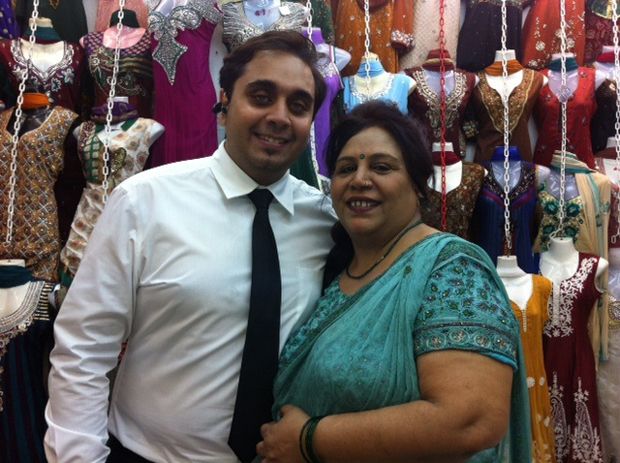 Textile, Fashion accessory, Tradition, Temple, Maroon, Sari, Ceremony, Tie, Marriage, Bangle, 