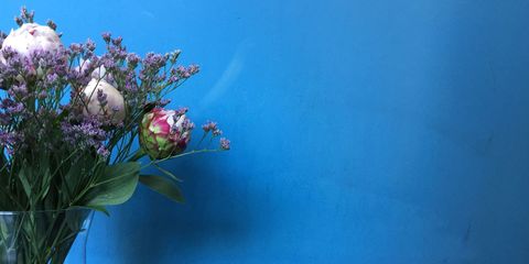 Flower Vase On Table Against Wall
