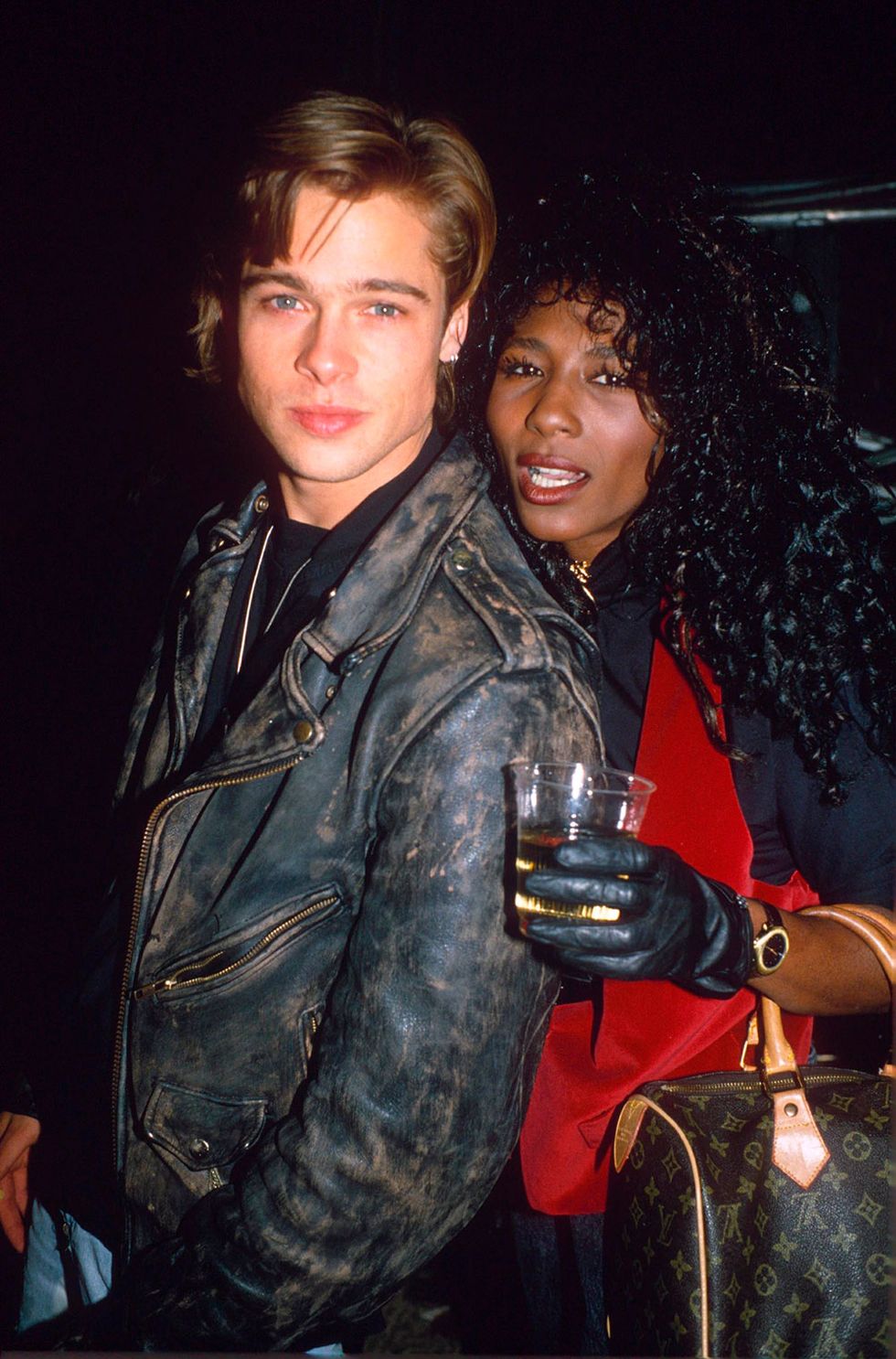 Hair, Hairstyle, Jacket, Jheri curl, Leather jacket, Alcohol, Black hair, Drink, Leather, Alcoholic beverage, 
