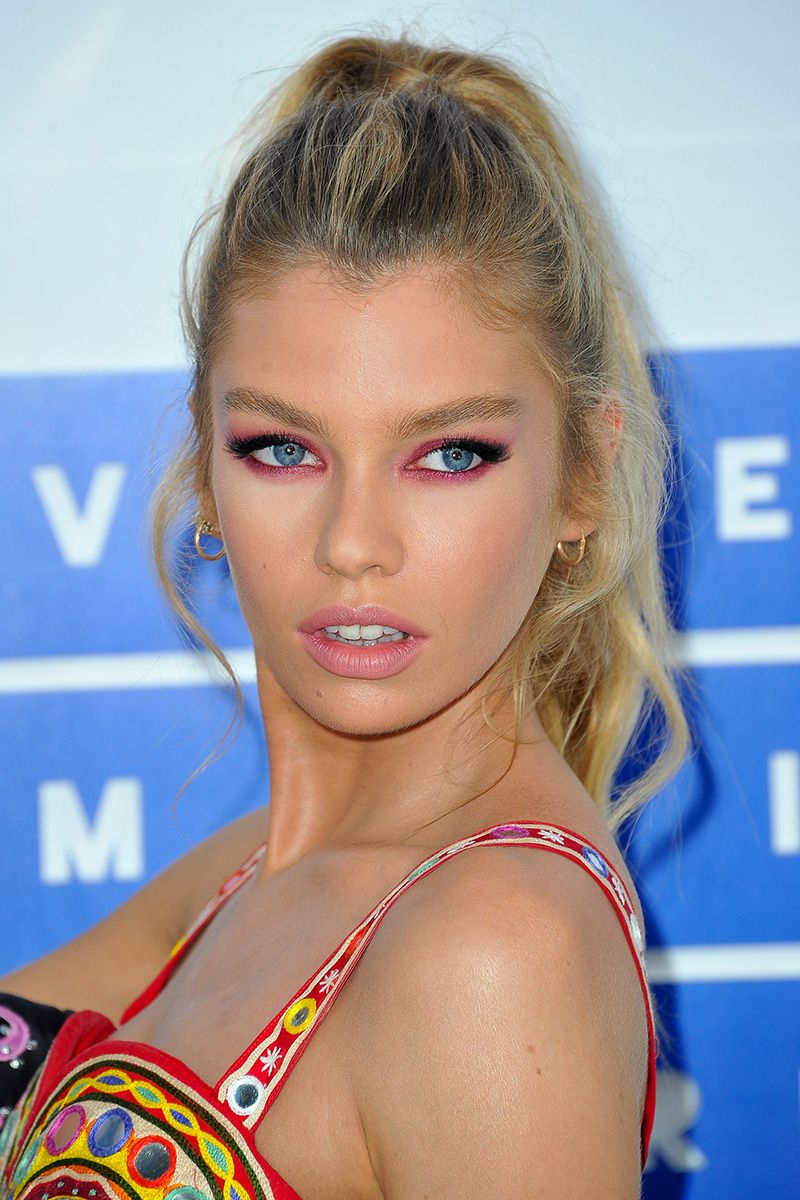 <p>Nothing makes blue eyes pop like a ring of fuchsia eye shadow, as seen here on model Stella Maxwell.</p>