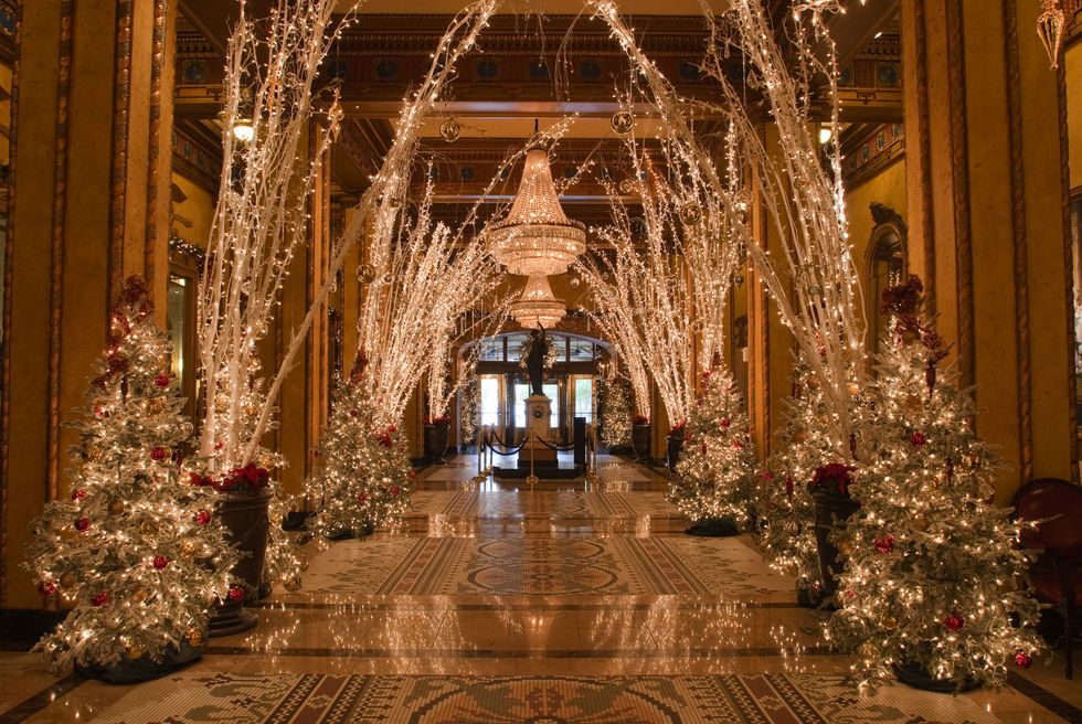 Christmas, Tree, Christmas decoration, Lighting, Architecture, Building, Tradition, Aisle, Christmas tree, Interior design, 