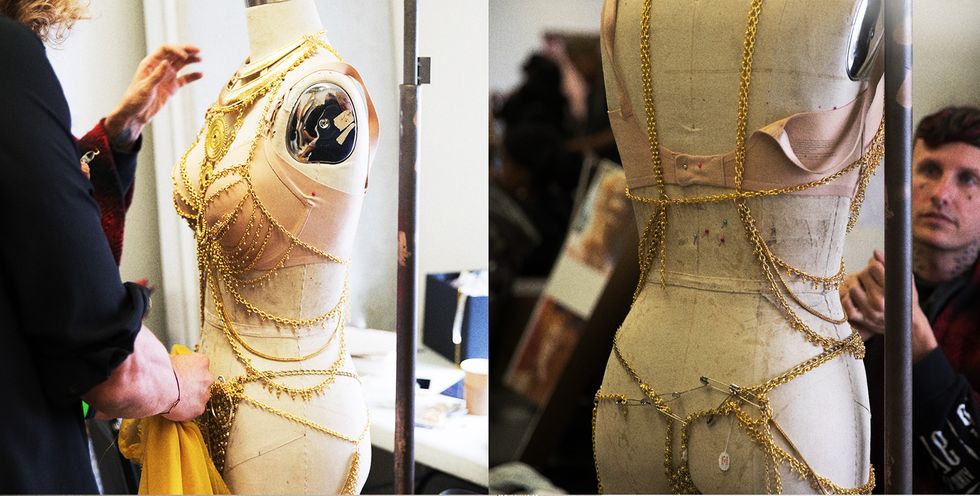 Yellow, Sleeve, Fashion, Mannequin, Fashion design, Costume design, Embellishment, Armour, Natural material, Tradition, 