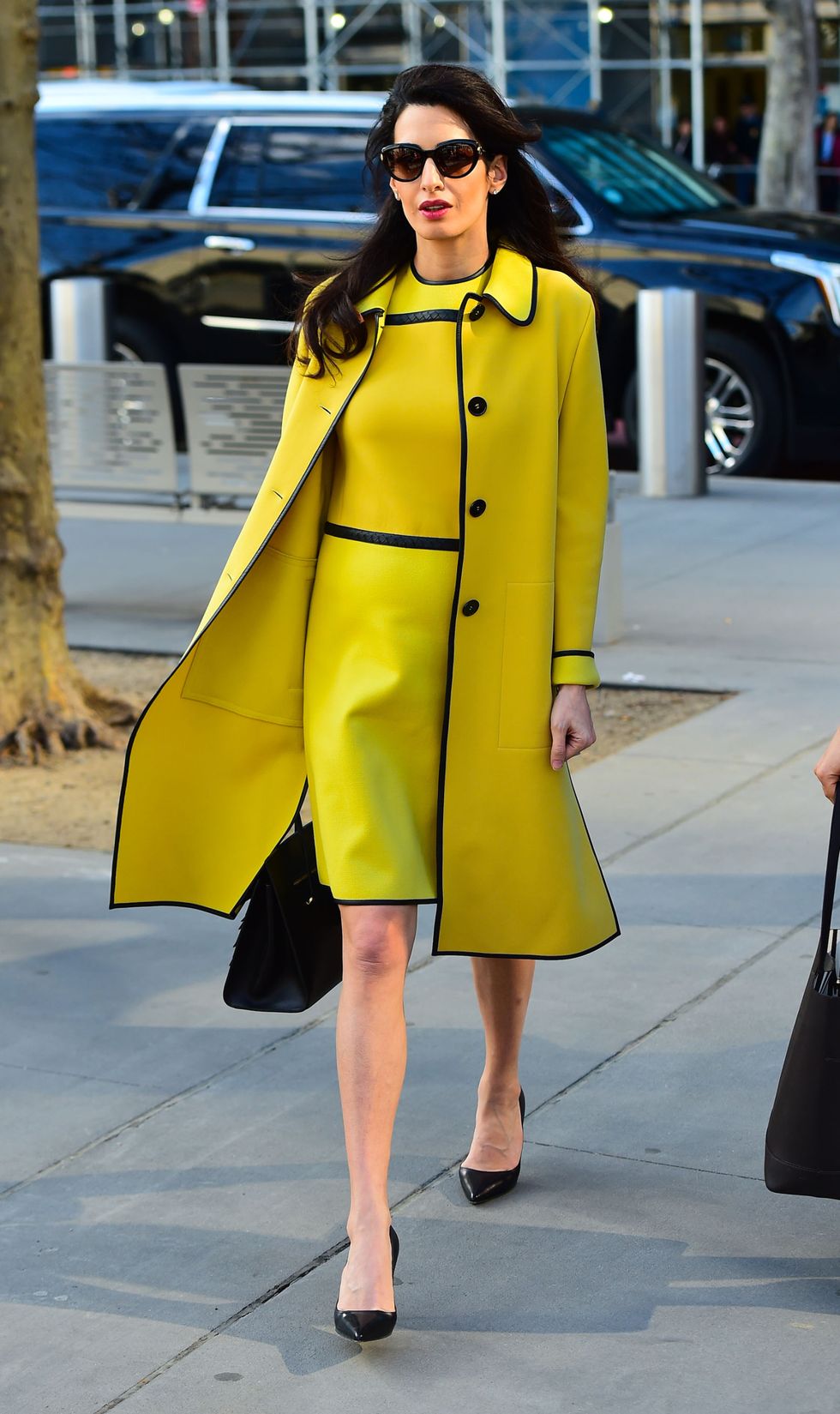 Clothing, Street fashion, Yellow, Fashion, Coat, Fashion model, Outerwear, Trench coat, Overcoat, Haute couture, 