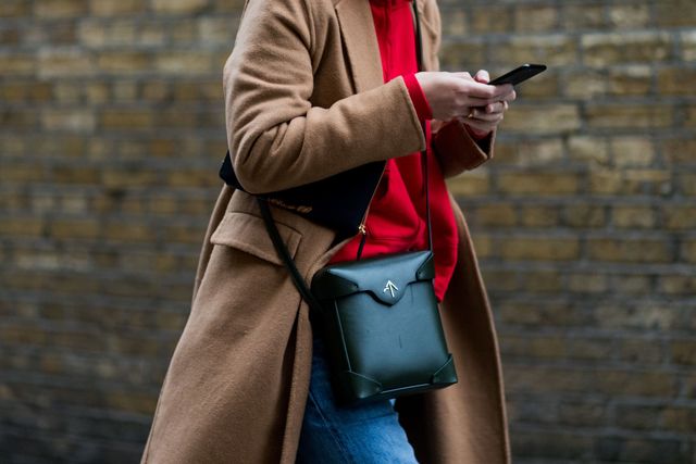 Red, Street fashion, Coat, Fashion, Human, Outerwear, Technology, Street, Photography, Electronic device, 