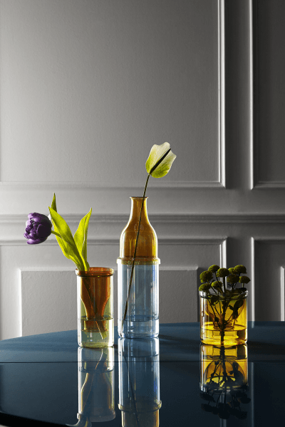 Yellow, Vase, Still life photography, Glass, Room, Glass bottle, Interior design, Table, Shelf, Furniture, 