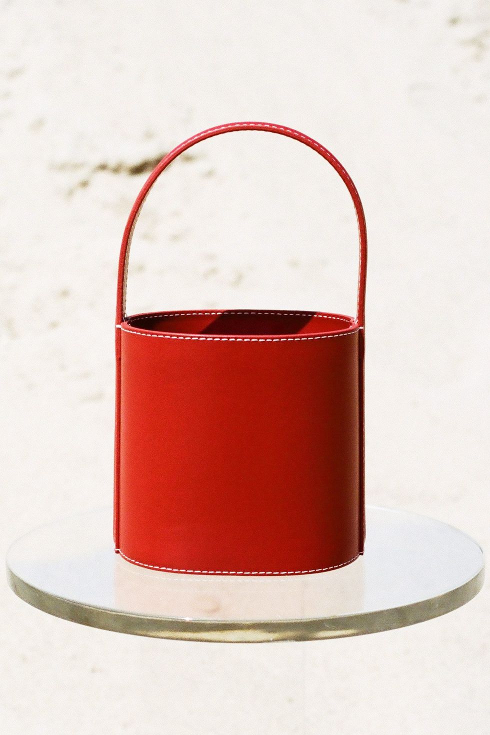 Red, Costume accessory, Carmine, Coquelicot, Maroon, Cylinder, Material property, Still life photography, Costume hat, 