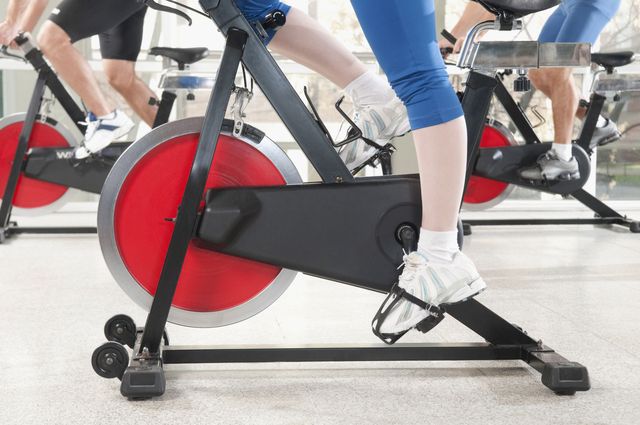 Exercise equipment, Exercise machine, Leg, Human leg, Exercise, Physical fitness, Stationary bicycle, Gym, Bench, Muscle, 