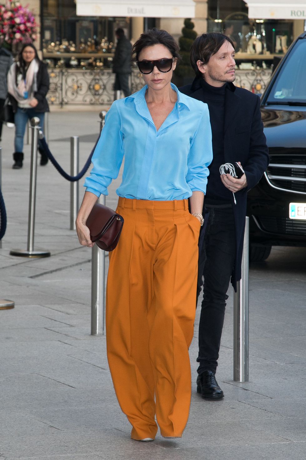 Street fashion, Clothing, Fashion, Orange, Turquoise, Sunglasses, Electric blue, Waist, Eyewear, Footwear, 