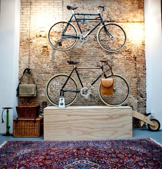 Bicycle, Room, Wall, Bicycle wheel, Vehicle, Architecture, Table, Interior design, Furniture, Flooring, 
