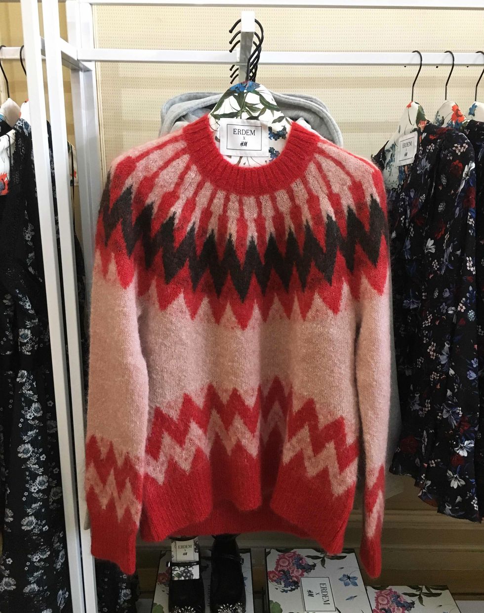 Clothing, Red, Outerwear, Clothes hanger, Fashion, Fur, Boutique, Textile, Sleeve, T-shirt, 