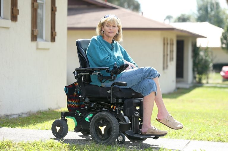 Motorized wheelchair, Lawn, Wheelchair, Lawn mower, Mower, Grass, Outdoor power equipment, Vehicle, Riding mower, Sitting, 