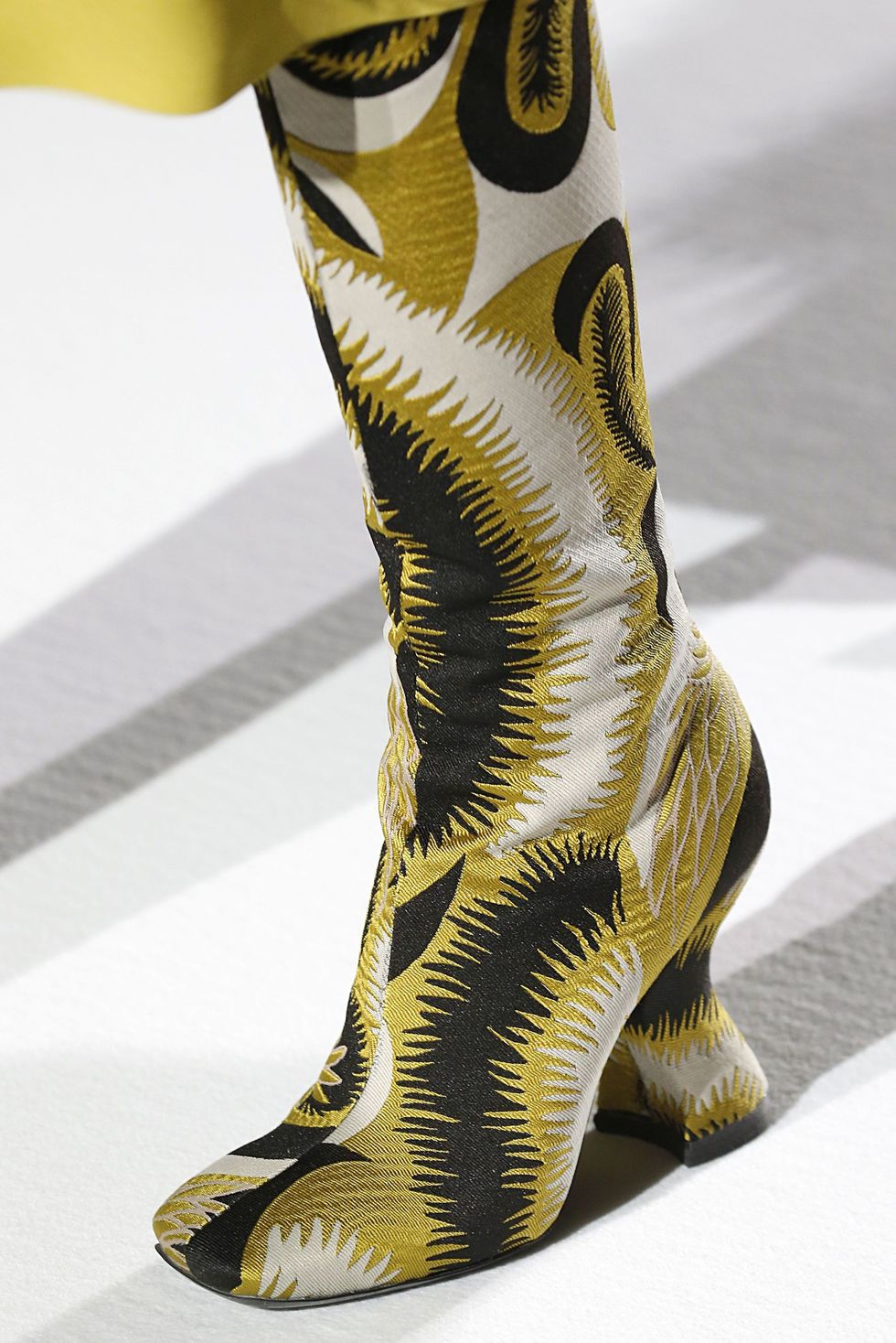 Yellow, Boot, Sculpture, Visual arts, Synthetic rubber, Foot, Knee-high boot, 