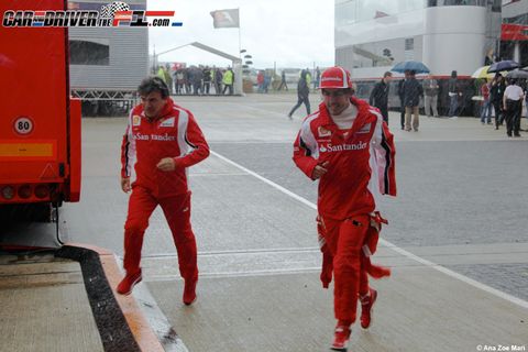 Red, Workwear, Service, Costume, Umbrella, Overall, Race track, Walking, 