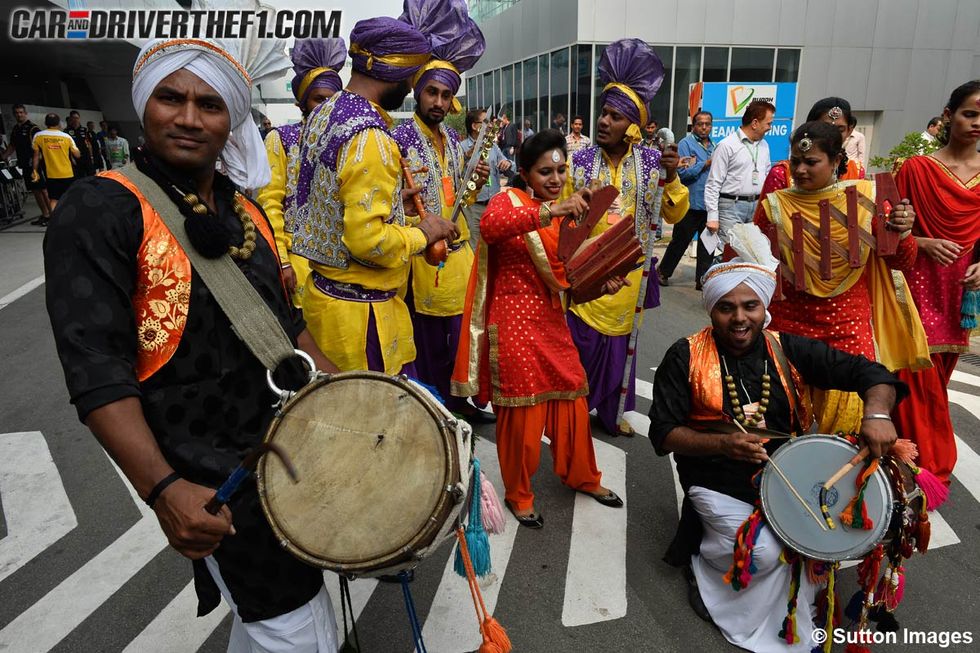 Drum, Musical instrument, Membranophone, Musician, Percussion, Drumhead, Tradition, Band plays, Headgear, Musical ensemble, 