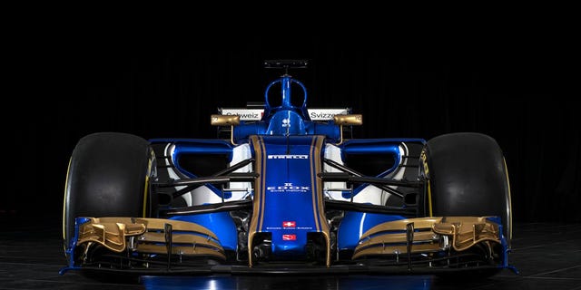 Automotive design, Blue, Open-wheel car, Automotive exterior, Automotive tire, Auto part, Race car, Logo, Formula one car, Formula one, 