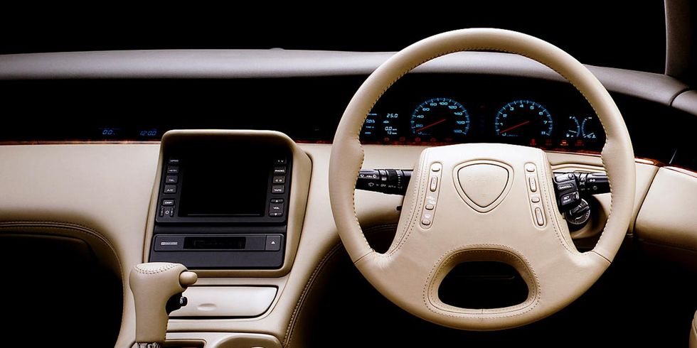 Motor vehicle, Steering part, Steering wheel, Luxury vehicle, Center console, Beige, Auto part, Gauge, Mercedes-benz, Vehicle audio, 