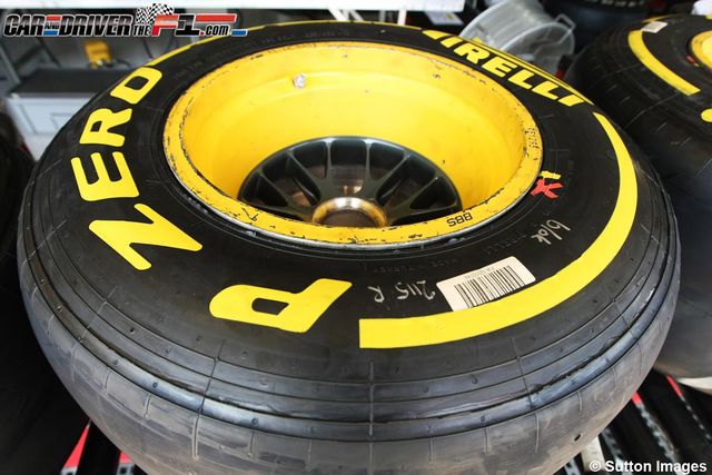 Automotive tire, Yellow, Rim, Automotive wheel system, Synthetic rubber, Tread, Light, Carbon, Auto part, Gas, 