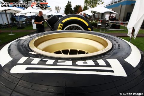 Automotive tire, Tent, Logo, World, Circle, Synthetic rubber, Engineering, Canopy, 