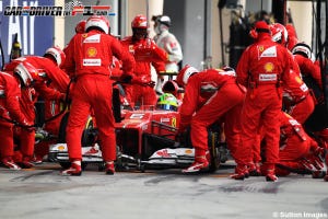 Race track, Red, Formula one, Pit stop, Carmine, Team, Race car, Workwear, Crew, Emergency service, 