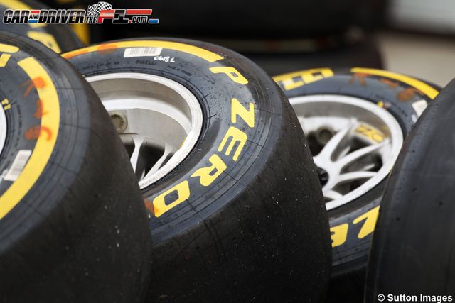 Tire, Automotive tire, Automotive design, Automotive wheel system, Formula one tyres, Rim, Synthetic rubber, Tread, Logo, Auto part, 