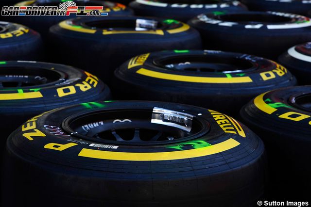 Automotive tire, Yellow, Green, Text, Rim, Automotive wheel system, Synthetic rubber, Light, Black, Plastic, 