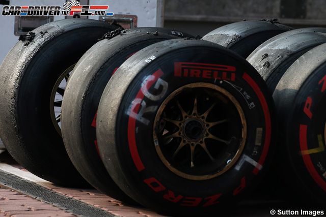 Automotive tire, Red, Carmine, Logo, Synthetic rubber, Automotive wheel system, Gas, Circle, Tread, Formula one tyres, 