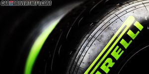 Automotive tire, Green, Yellow, Rim, Automotive wheel system, Colorfulness, Text, Synthetic rubber, Logo, Font, 