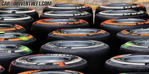 Automotive tire, Orange, Automotive wheel system, Rim, Synthetic rubber, Tread, Formula one tyres, Light, Auto part, Black, 