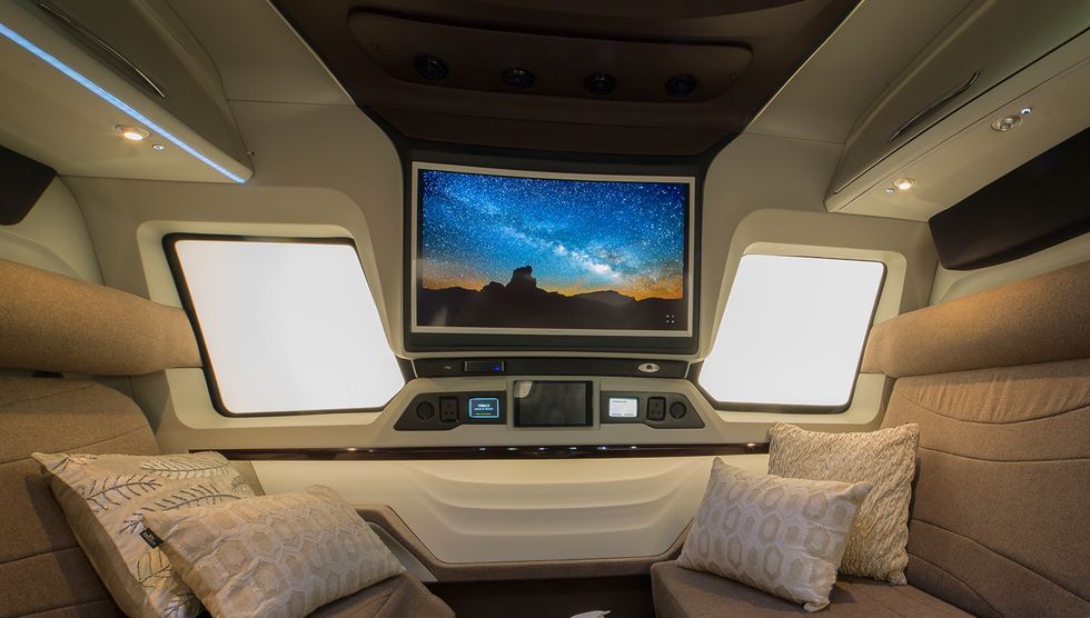 Luxury vehicle, Vehicle, Airline, Air travel, Electronics, Car, Screen, Room, Multimedia, Display device, 