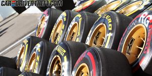 Yellow, Automotive tire, Logo, Synthetic rubber, Circle, Symbol, Paint, Brand, Formula one tyres, Tread, 