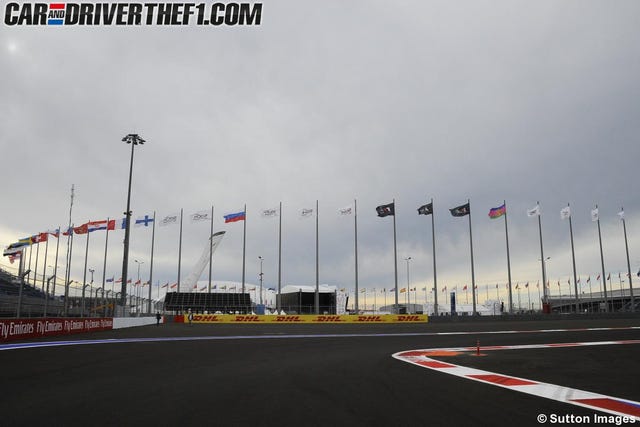 Cloud, Infrastructure, Road surface, Asphalt, Pole, Race track, Tar, Flag, Public utility, Stadium, 