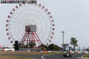 Ferris wheel, Daytime, Road, Infrastructure, Road surface, Asphalt, Photograph, Automotive tire, Red, Public space, 