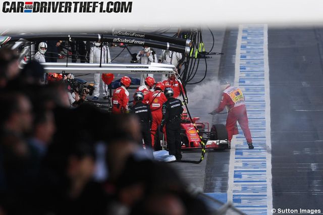 Race track, Helmet, Racing, Team, Pit stop, Formula one, Motorsport, Sports gear, Race car, Crew, 