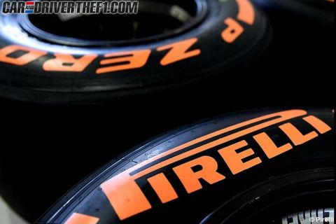 Yellow, Orange, Automotive tire, Text, Amber, Logo, Font, Synthetic rubber, Automotive wheel system, Close-up, 